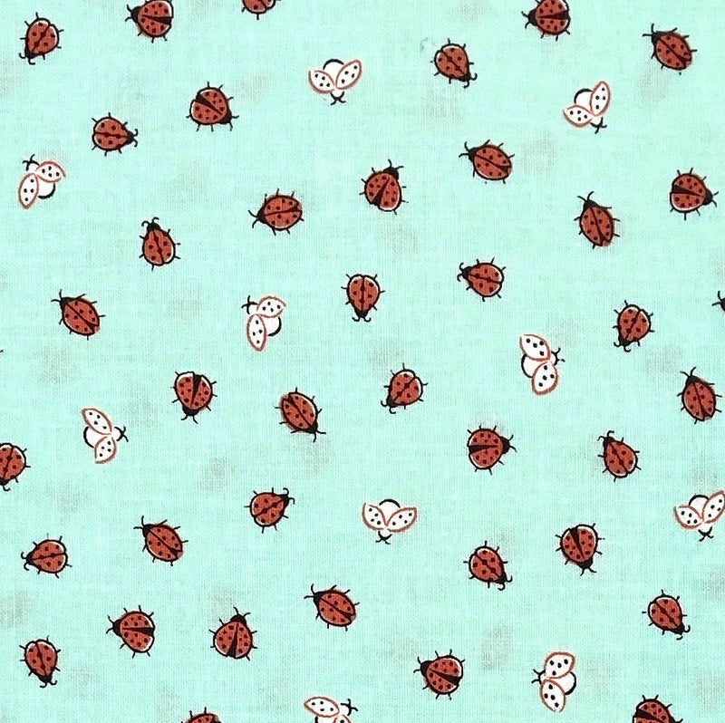 Red and white ladybugs on a mint green background