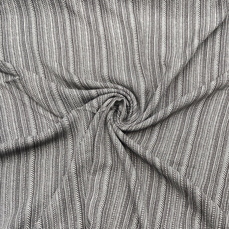 A close-up of grey striped fabric filling the frame but scrunched in the middle in a swirl.