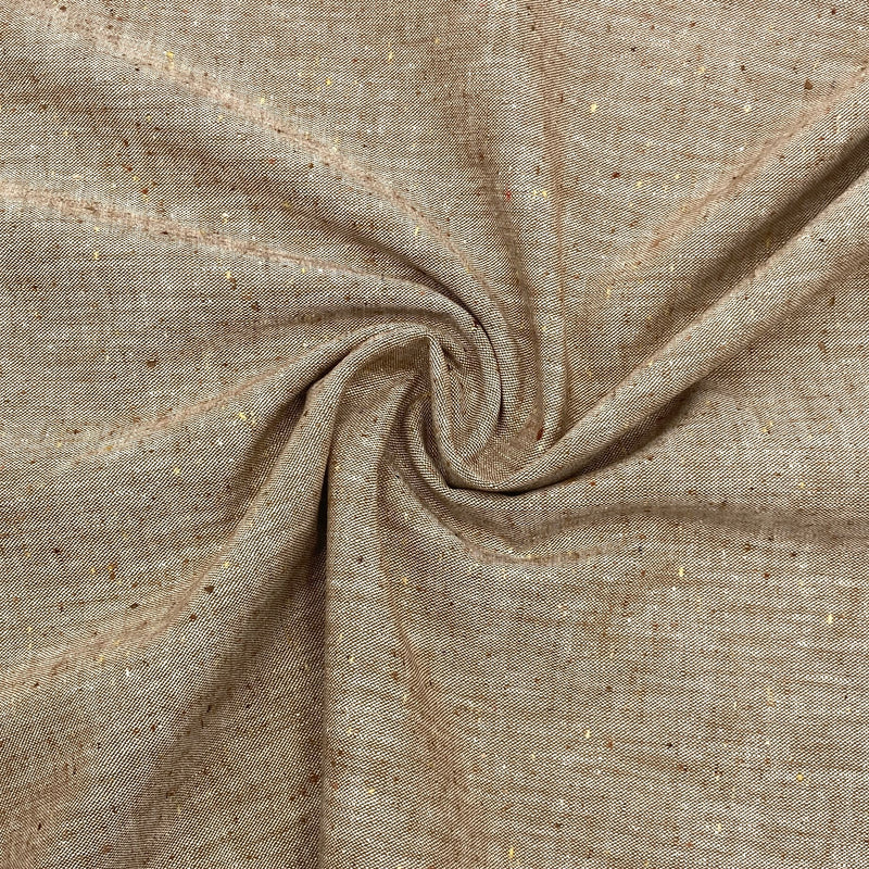 A brown speckled chambray fabric is scrunched in a swirl pattern to better show the thickness and texture of the fabric.