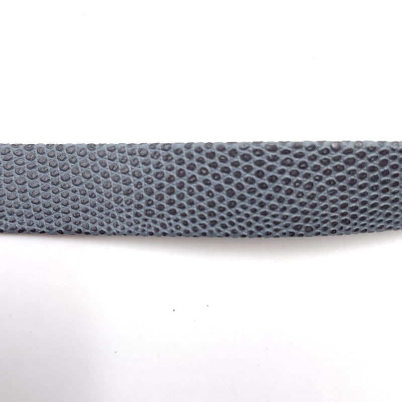 A close-up of this grey trim that shows its faux snakeskin texture.